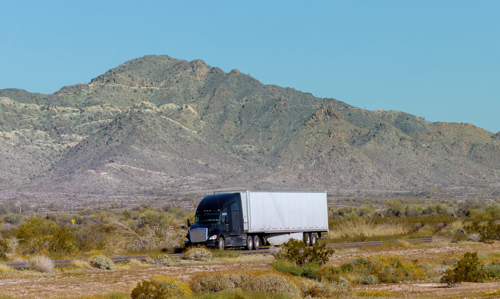 Blue Kenworth dry van in Arizona