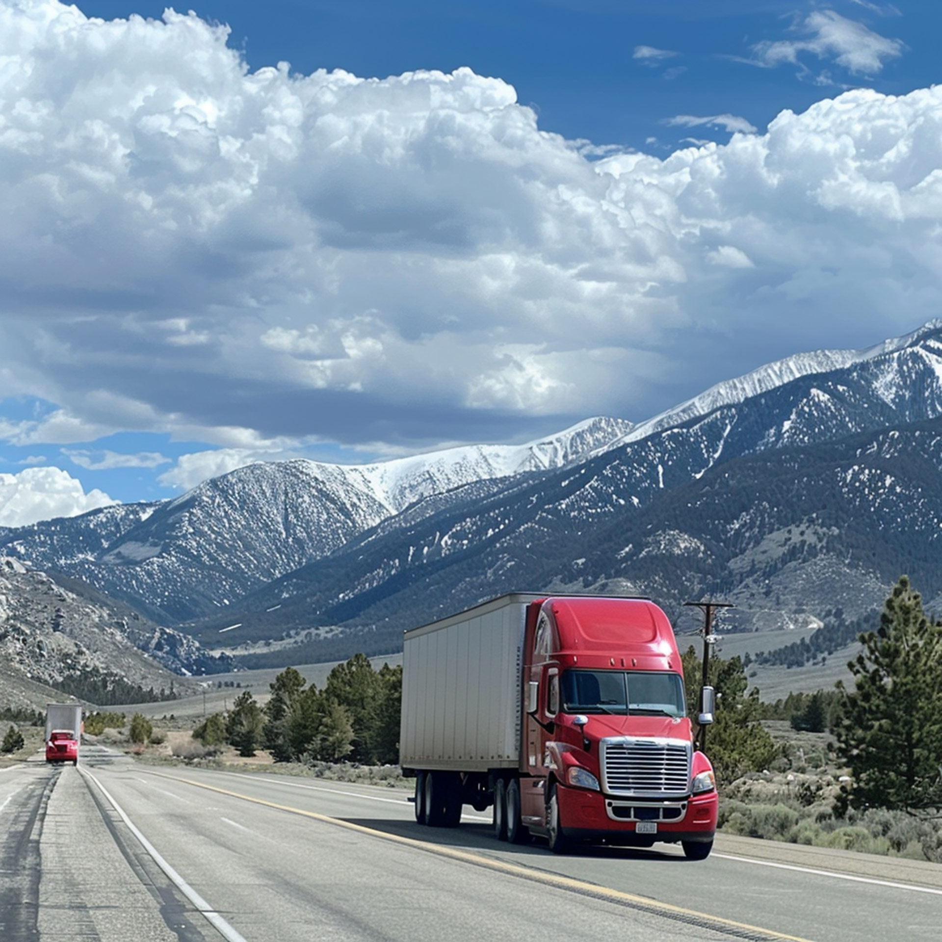 Red Freightliner on highway